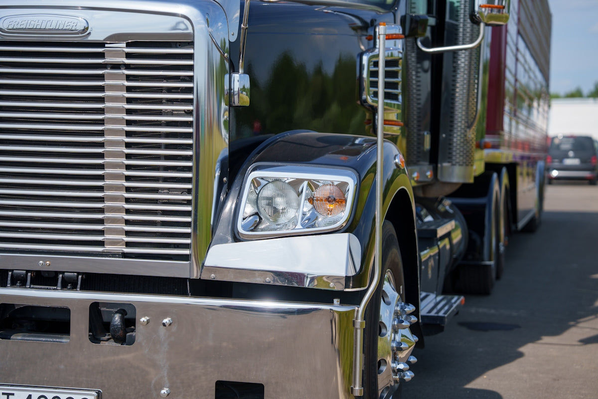 Close-up of a shiny black semi-truck